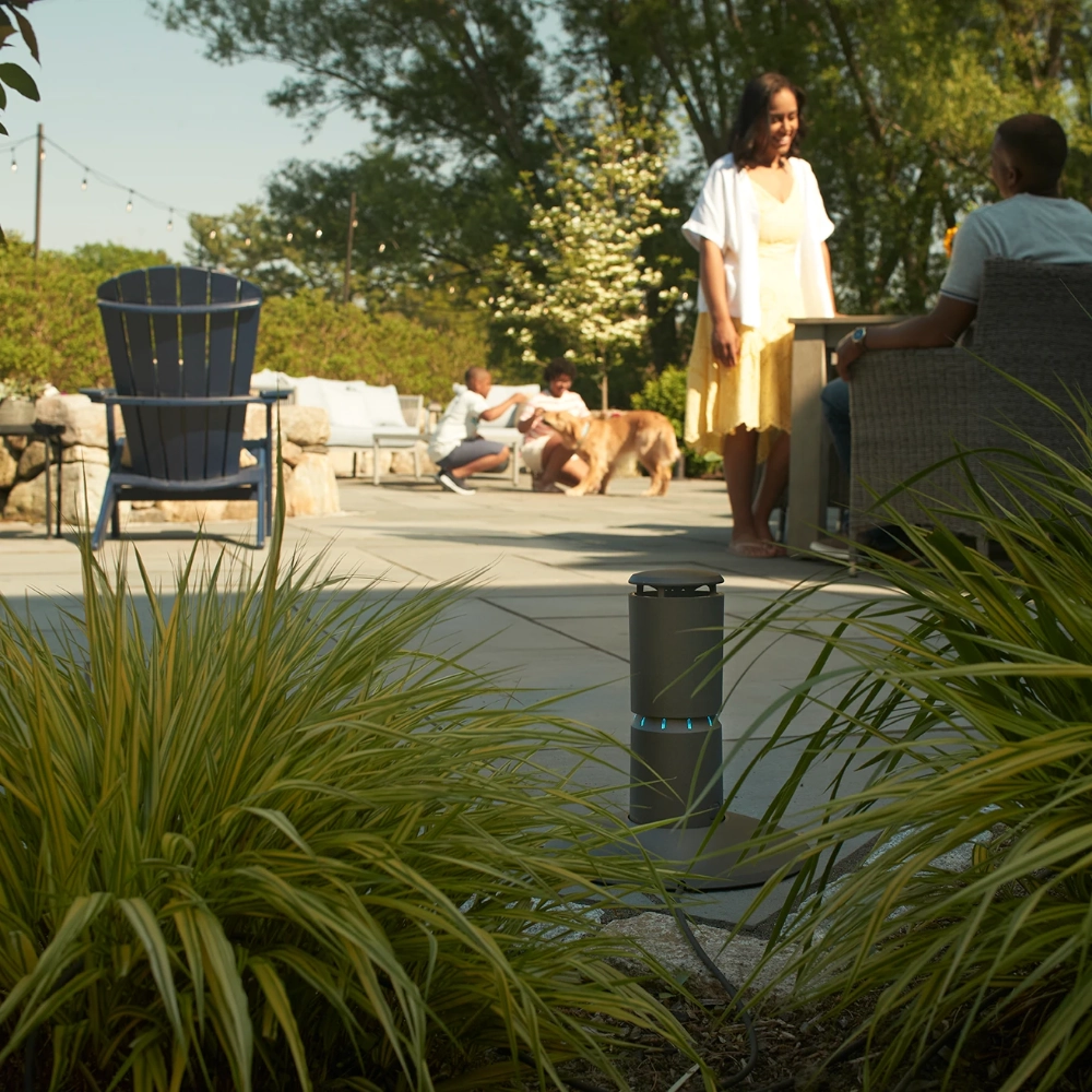 A Thermacell mosquito repellent system device sat positioned on a deck
