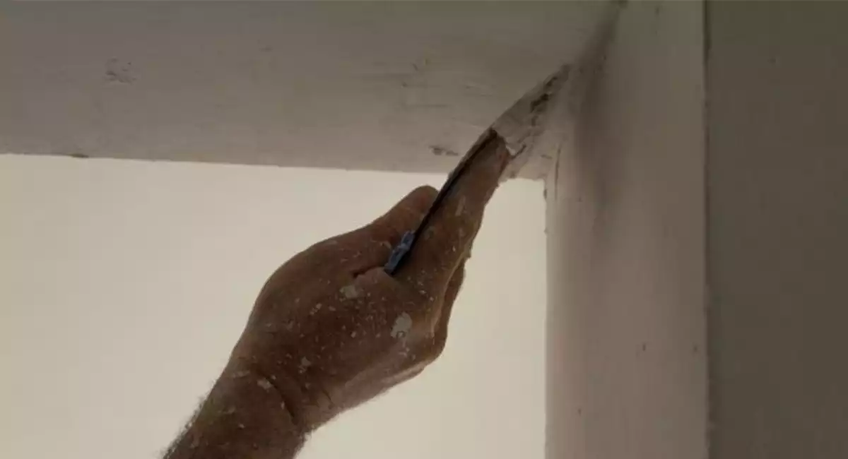 Professional repairman fix holes and cracks in walls.